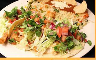 Fish Tacos · 3 soft tacos with lettuce, tomatoes, mozzarella cheese. Served with rice and chipotle sour cream.