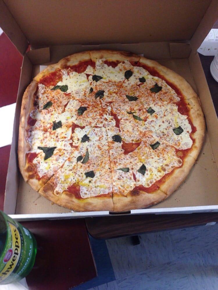 Large Margarita Pizza · Comes with fresh mozzarella, basil, olive oil and tomato sauce.