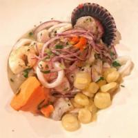 Ceviche Mixto · Mixture of fish, shrimp, and calamari cured in lime juice, spiced with aji and garnished wit...
