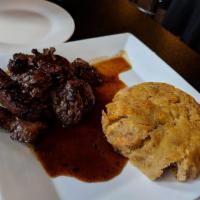 Mofongo · Fried plantains, hand-mashed along with garlic butter and UNAVAILABLE fried pork shoulder. Y...