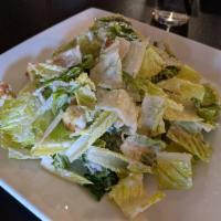 Roasted Garlic Caesar Salad · Crisp romaine lettuce tossed in our roasted garlic Caesar dressing. Topped with Parmesan che...