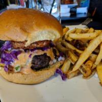 Top Mix Burger · Marinated ground beef grilled to perfection, topped with shredded red cabbage, fried cheese,...