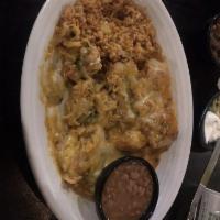 Chile Rellenos · Three crispy rellenos filled with Cheddar and Monterey Jack. Smothered with New Mexico Hatch...