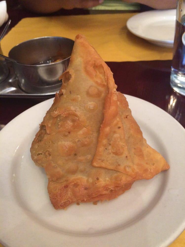 Vegetable Samosa · 1 piece. Triangular shaped crispy turnovers filled with potatoes and green peas.