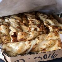 Garlic Parmesan Twists · Freshly rolled dough seasoned with fresh garlic, our three cheese blend, Parmesan cheese, an...