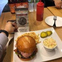 The Wise Guy Burger · Crispy chicken, beef patty and pastrami served on a brioche with lettuce, grilled tomatoes a...