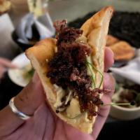 Crispy Short Rib Hummus · Grilled onions, sherry, beef jus.  Served with House Bread (2pcs).