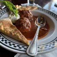Hand Rolled Meatballs with Ricotta · Large meatballs slowly cooked in our tomato sauce.