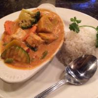 Yellow Curry · Choice of meat prepared in our yellow curry sauce with carrots, onions and potatoes. Served ...