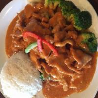 Thailand Chicken · Chicken marinated in garlic and rum over steamed vegetable topped off with creamy peanut sau...