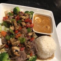 East Meets West · A sampling of 2 different tastes in Thai cooking. Grilled marinated steak covered in our del...