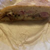Cuban Sandwich · Roasted pork shoulder, smoked ham, swiss cheese, grain mustard and house made pickles on a r...