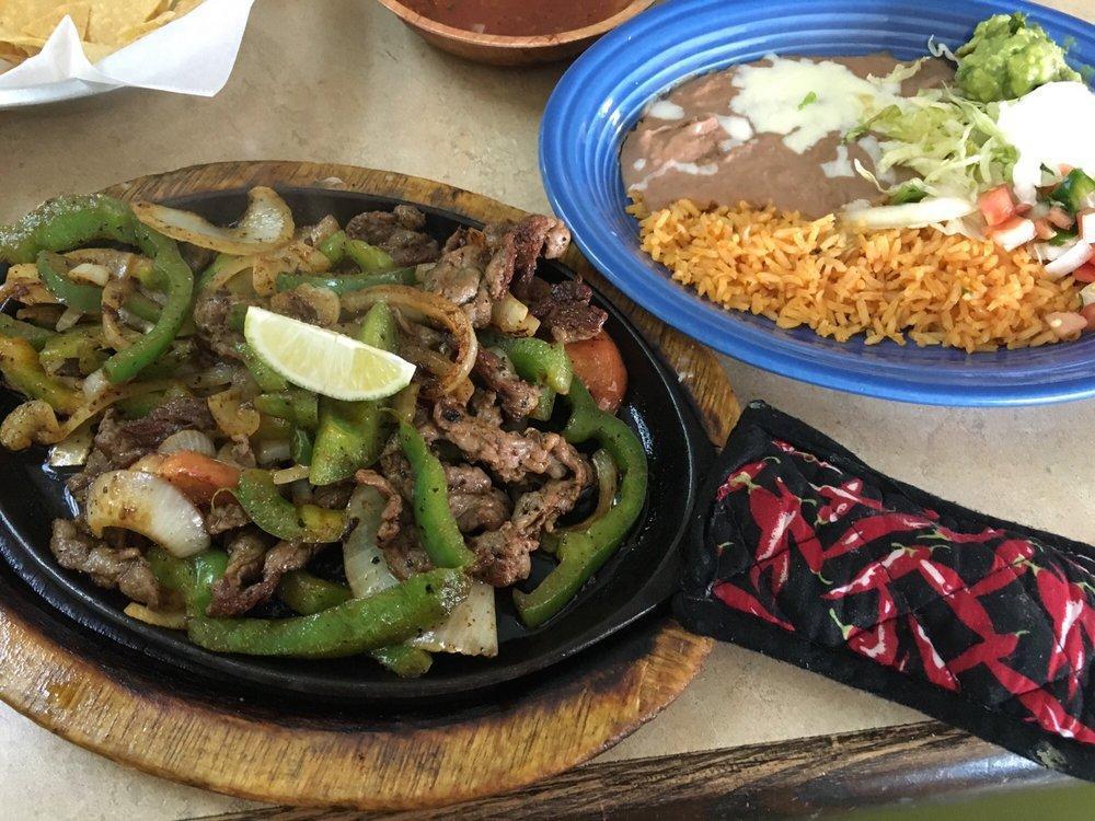 Fajitas · Your choice of chicken, beef or mixed seasoned and grilled to perfection with bell peppers, onions and tomato.