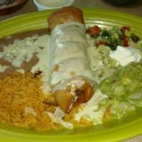 Chimichanga · A flour tortilla stuffed with ground beef or shredded chicken. Deep fried then topped with o...