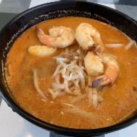 Laksa · Rice noodles with shrimps, fish cake, tofu in a coconut based soup.
