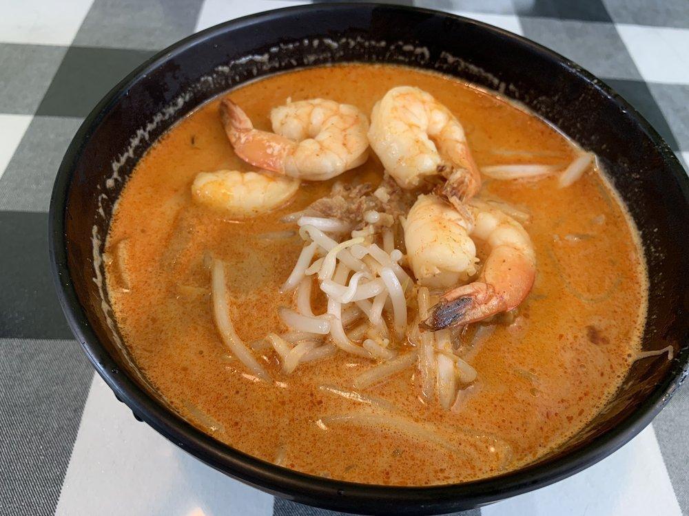 Laksa · Rice noodles with shrimps, fish cake, tofu in a coconut based soup.