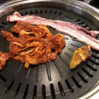 Spicy Pork Bulgogi · Includes rice and 2 sides.