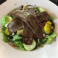 Gyros Salad · A slice of gyro meat over our Greek salad.