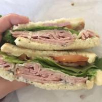 Little Italy Sandwich · Basil mayo, provolone cheese, and ham  topped with red onion, tomato, lettuce and Italian dr...