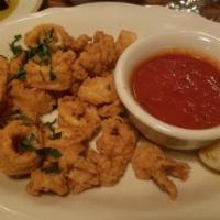 Fried Calamari · Lightly coated and fried to a golden brown, served with a side of marinara sauce