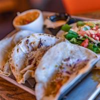 Lobster Taco · 3 grilled lobster tacos, topped with mango salsa, coleslaw, and Mexican cheese. Side of rice...