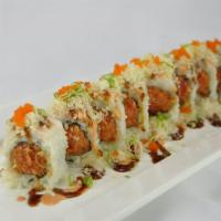 Dynamite Roll · Spicy crunchy tuna inside topped with shrimp, avocado, tempura flakes, tobiko, scallions, an...