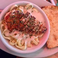 Chicken Fettuccini Alfredo · A hearty marinated chicken breast, grilled, sliced and placed atop a bed of fettuccini Alfre...