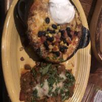 Tijuana Trainwreck · Corn tortillas, machaca chicken, chile verde, chile con carne, bolo beans, jack cheese, corn...