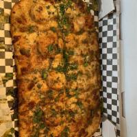 The Trap Pizza · Featuring chef Oya's OG garlic herb trap buttah. Shrimp, crab, mozzarella, topped with foodl...