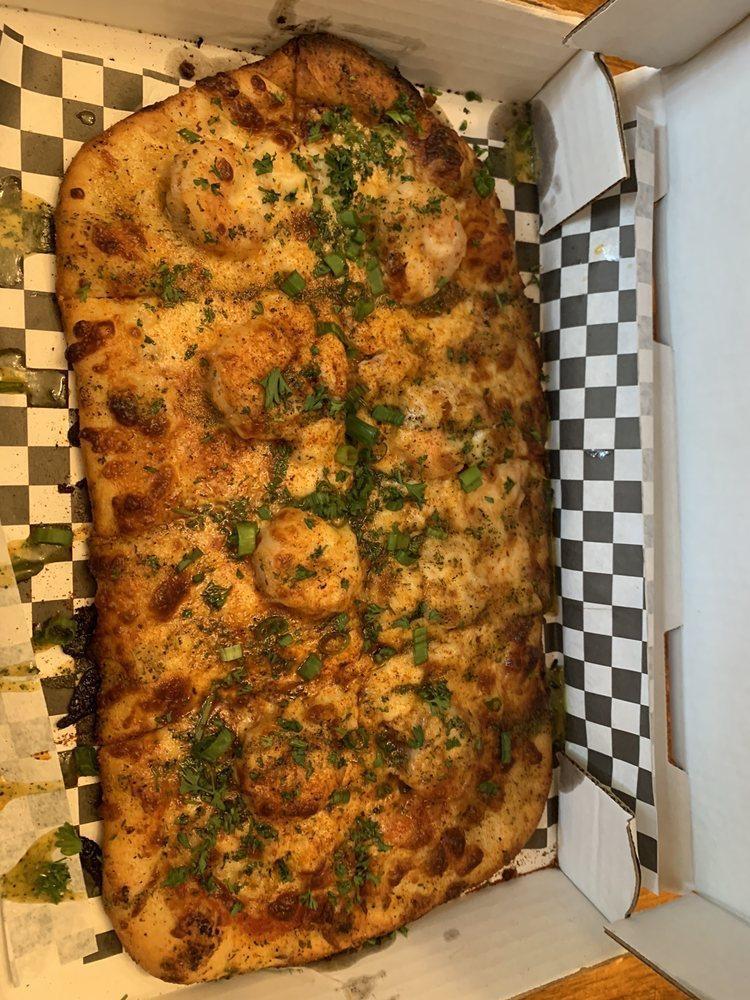 The Trap Pizza · Featuring chef Oya's OG garlic herb trap buttah. Shrimp, crab, mozzarella, topped with foodlovetog's young bae spice, garnished with fresh parsley and green onion.