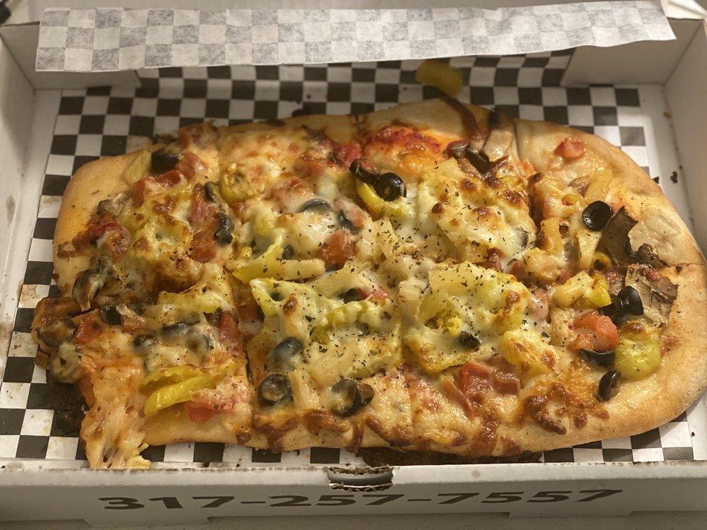 The Hippie Pizza · Mushrooms, tomato, banana peppers, red onion, olives, mozzarella, pizza sauce.