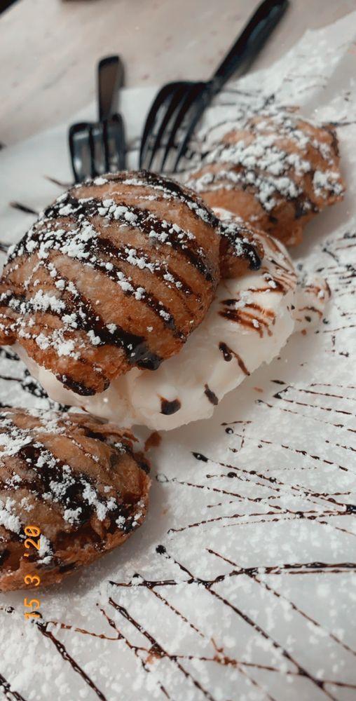 Fried Oreos · Served with a scoop of ice cream and drizzled in chocolate syrup.