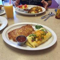Western Omelette · Green bell peppers, onions, ham, and cheddar cheese.