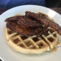 Chicken and Waffle · Our hand breaded chicken on a crispy waffle drizzled with smoky honey sauce 