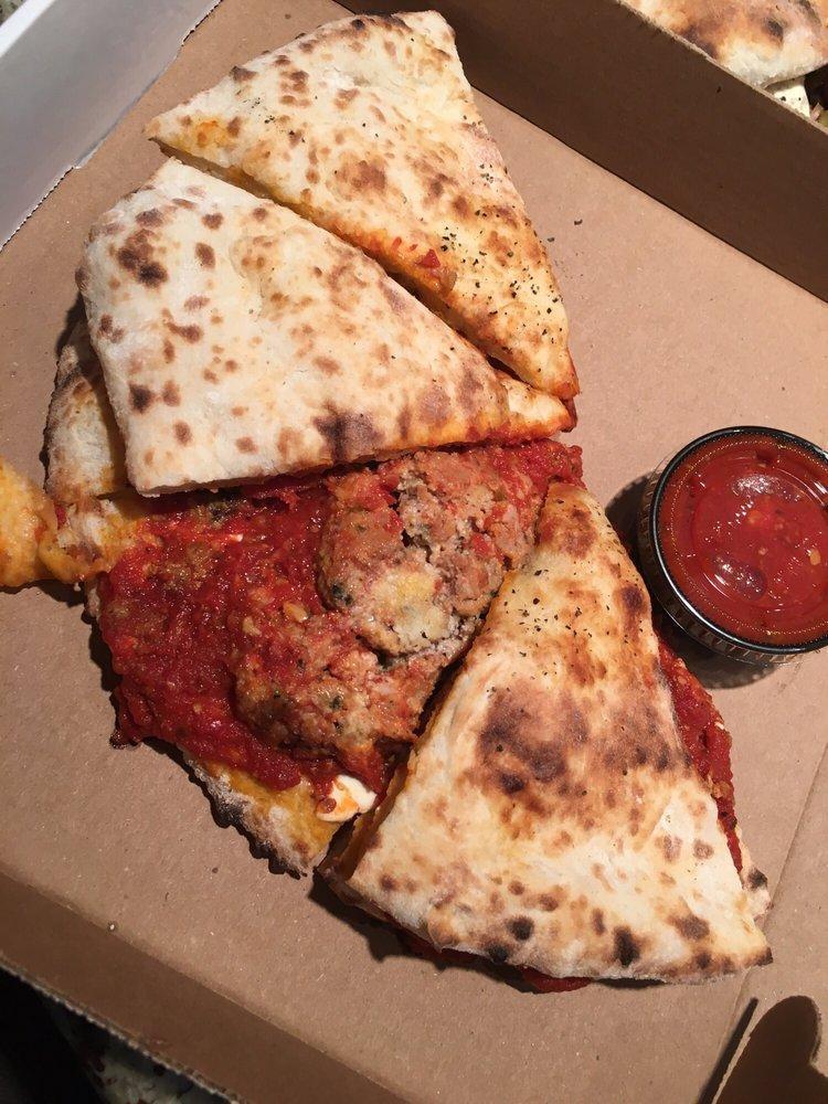 Messy Meatball Parm Flatbread · Homemade wood fired meatballs, fresh mozzarella, and Pecorino Romano with a side of marinara.