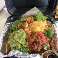 Tostada Salad · Choice of meat, rice, beans, cheese, lettuce and mild pico de gallo salsa on a freshly made ...