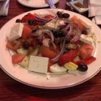 Bulgarian Salad · Tomatoes, roasted red peppers, red onions, cucumbers, olives, boiled eggs, feta cheese, saut...