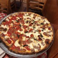 Regular Pizza · Fresh mozzarella, crushed tomatoes and basil.