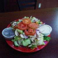 Garden Salad · Fresh greens topped with cucumber, shred carrots, red onions and tomatoes.