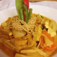 Yellow Curry · Choice of protein, bamboo shoots, sweet potatoes and fresh basil simmered with yellow curry ...