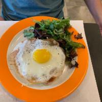 Croque Madame Sandwich · Grilled Swiss cheese on white bread with ham, bechamel and sunny side egg on top, served wit...