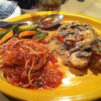 Red Snapper · Lightly blackened topped with tomato, shrimp and lemon butter sauce served with pasta & vegg...
