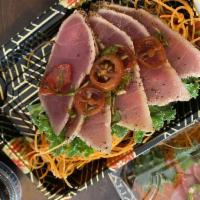 Pepper Tuna · Sliced lightly cooked black pepper tuna with chefs special sauce. Raw item.