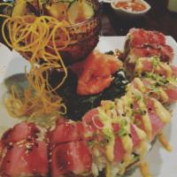 Tigress Roll · Spicy tuna, tempura crunch, and avocado inside, topped with Seared tuna, scallion and spicy ...