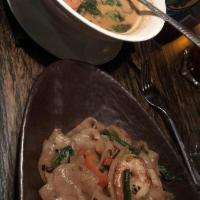 Red Curry · Red bells, bamboo shoots and Thai basil with choice of protein. Spicy.