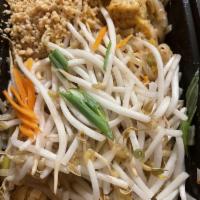 Pad Thai · Egg, bean sprouts, and rice noodles stir-fried in sweet tamarind sauce. Garnished with green...
