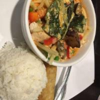 Red Curry · Thai eggplant, green beans, zucchini, bell peppers, bamboo peas, and fresh basil in Thai red...