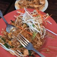 Pad Thai · The most popular Thai dish! Choice of protein with medium sized rice noodles, egg, green oni...