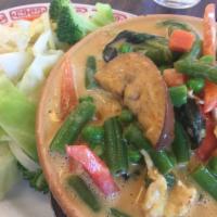 Panang Curry · Choice of protein with green beans, lemon leaves, bell peppers and basil leaves in panang cu...