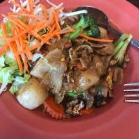 Pad Se Ew · Wide rice noodles glazed with egg, broccoli, carrots, and Thai sweet soy sauce.